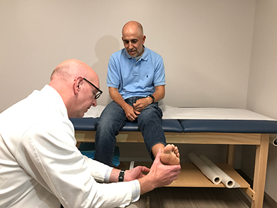 doctor examaning a patient's foot